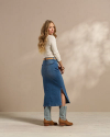 View from the side of the Women's Midi Denim Skirt in the color medium. 