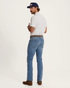 man wearing premium standard jeans in light wash