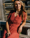 Woman outside wearing the Women's Short Sleeve Button Front Midi Dress in the color Multi Geo Floral Stripe.