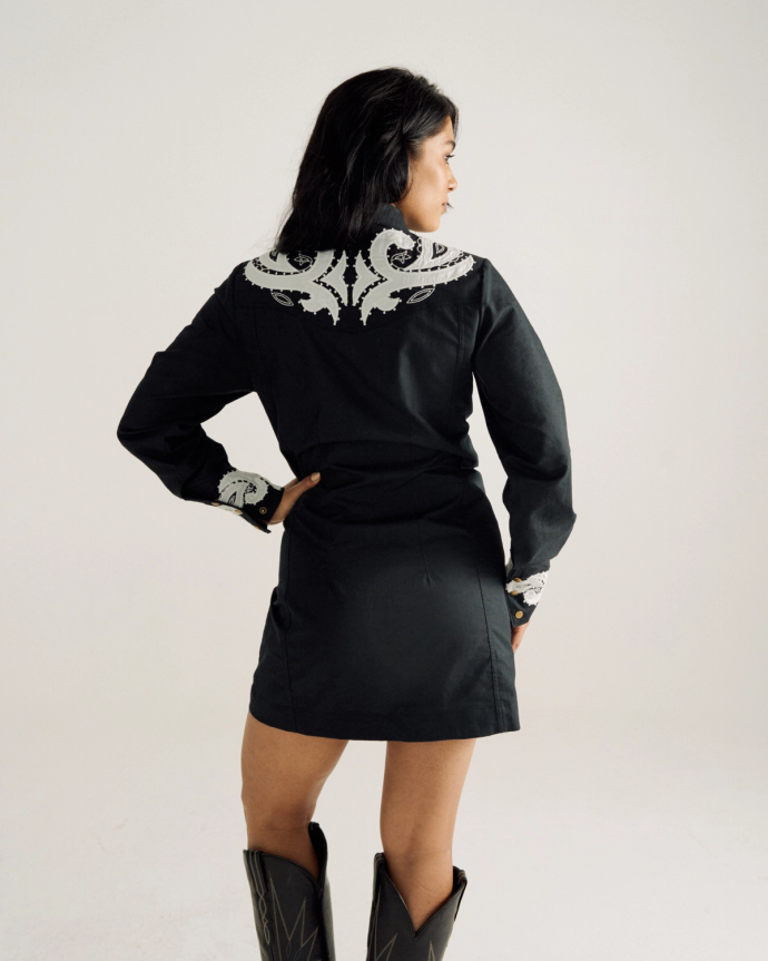 Back view of Women's L/S Applique Mini Dress - Black on model