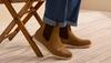 Man putting on the Tecovas Chance boot.