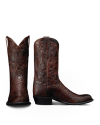 A pair of dark brown, textured leather cowboy boots with decorative stitching, one boot standing upright and the other boot tilted to show the side and heel.