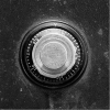 Close-up of a combination lock dial on a safe, showing numbers and a textured metal surface.