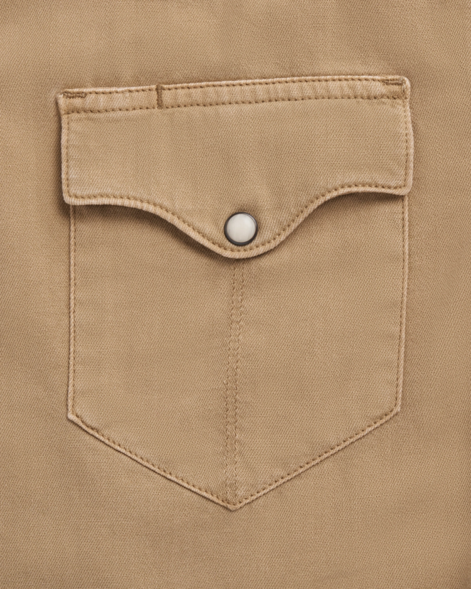 Closeup detail view of Men's Denim Pearl Snap SS - Coriander / Multi