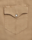 Closeup detail view of Men's Denim Pearl Snap SS - Coriander / Multi