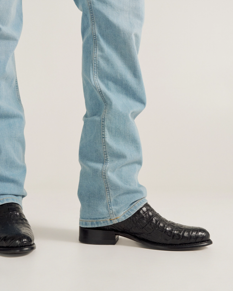 close up picture of Cole Midnight Black cowboy boots on a man's feet