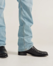 close up picture of Cole Midnight Black cowboy boots on a man's feet