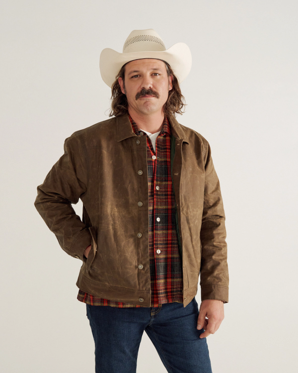 Front view of Buckaroo Waxed Canvas Trucker Jacket - Tobacco on model