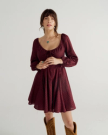 Front view of Women's L/S Mini Dress - Burgundy Floral on model