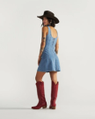 Back view of Women's Structured Mini Dress - Medium Wash on model