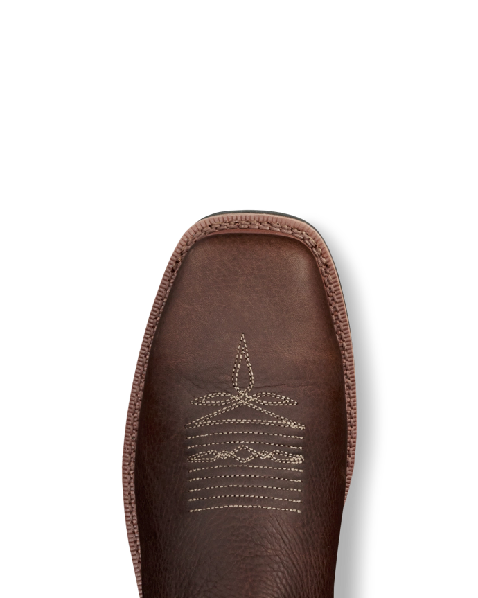 LongHaul Waterproof Square Composite Toe Work Boot in Tobacco / Black Cowhide. A close-up of the toe of a Tobacco / Black cowhide leather boot with white decorative stitching, set against a black background.