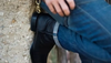 Man leaning against a wall wearing The Earl boots