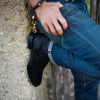 Man leaning against a wall wearing The Earl boots
