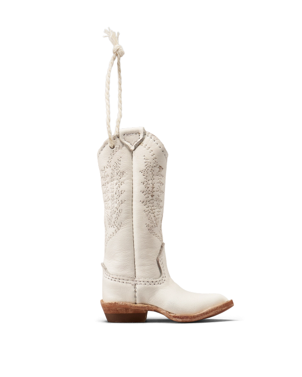 Profile view of Abby Boot Ornament - Snow on plain background