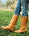 woman in in vintage tan cowgirl boots