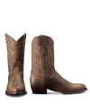 A pair of brown cowboy boots, one facing front and the other showing the side profile, displayed on a plain background.