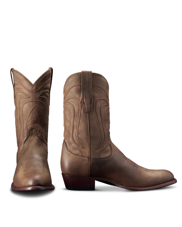 A pair of brown cowboy boots, one facing front and the other showing the side profile, displayed on a plain background.