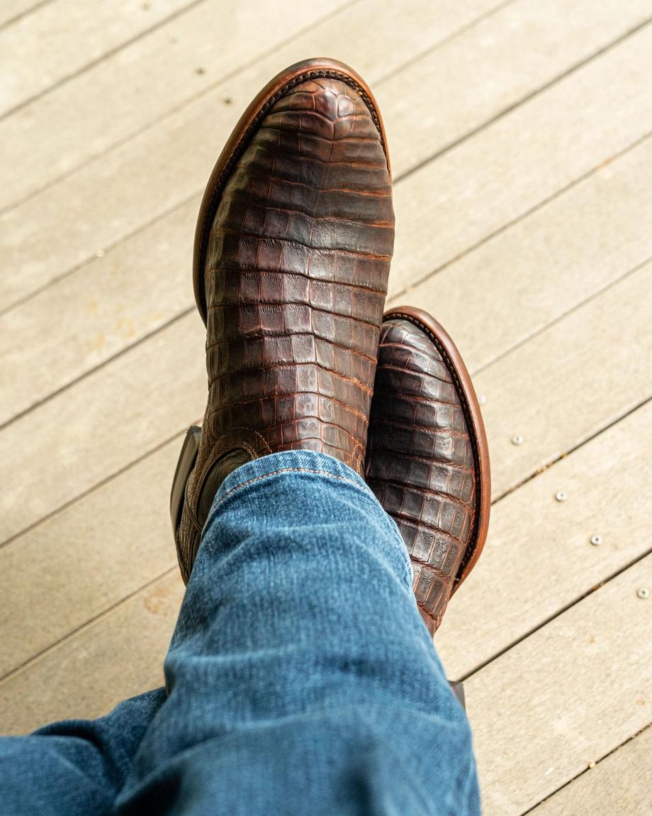 close up picture of Cole Mahogany brown cowboy boots on a man's feet