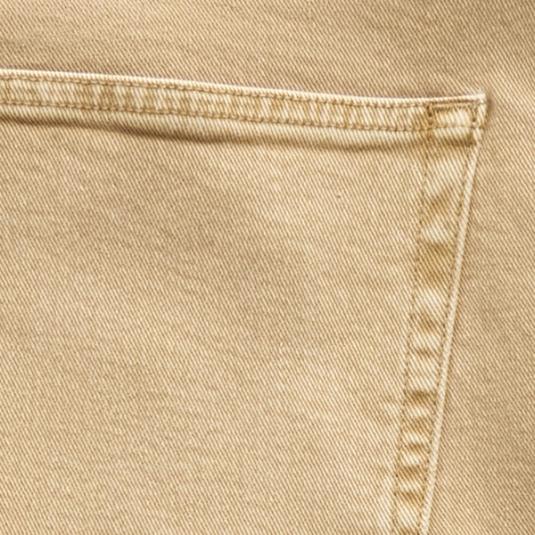 Close-up of a beige fabric pocket with visible stitching, likely from a pair of pants or jeans.