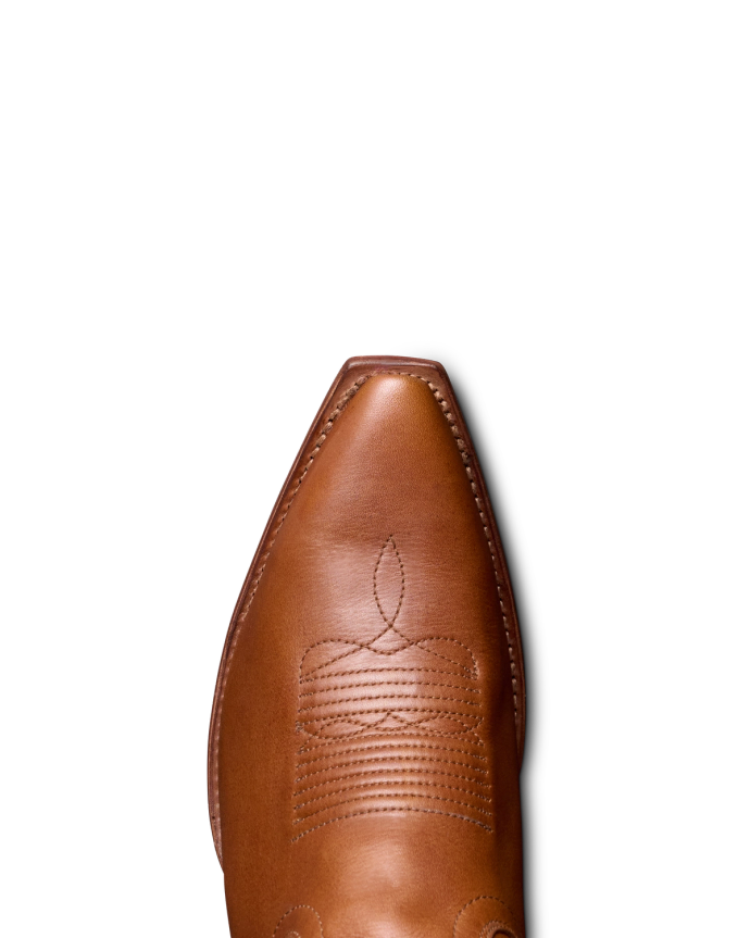 Toe view of The Sadie - Honey / Gold Cowhide on plain background