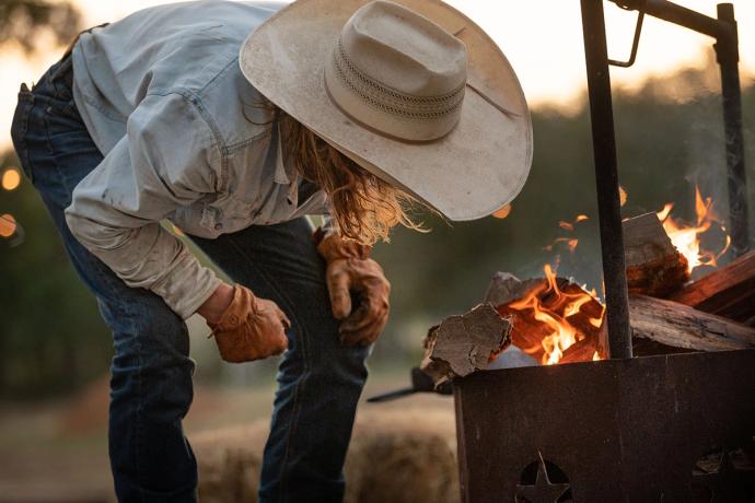 a man looking into a fire