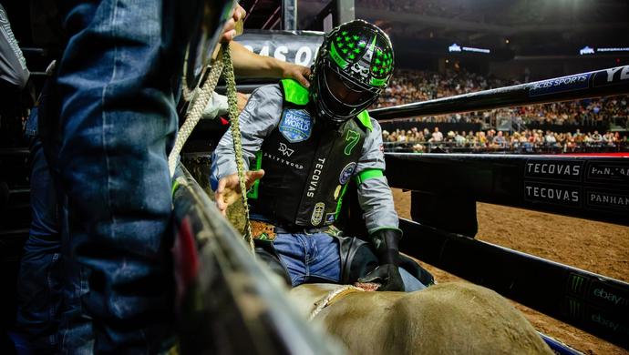 Man getting ready to ride a bull