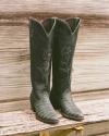 Cowboy boots, green bench
