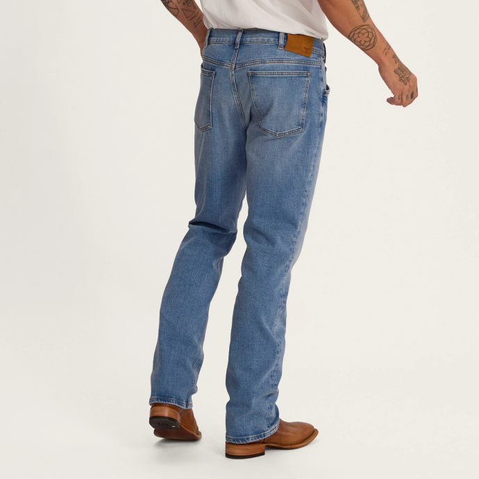 Back view of Men's Rugged Relaxed Jeans - Light on plain background