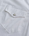 Closeup detail view of Men's Easywear Short Sleeve Pearl Snap - White