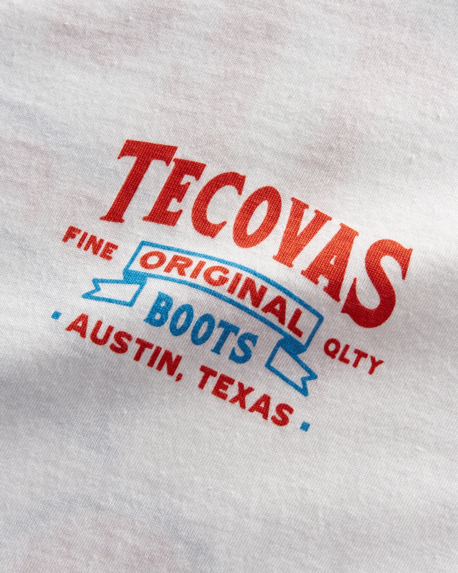 Closeup detail view of Men's Armadillo Cowboy Tee - Bone/Orange/Blue