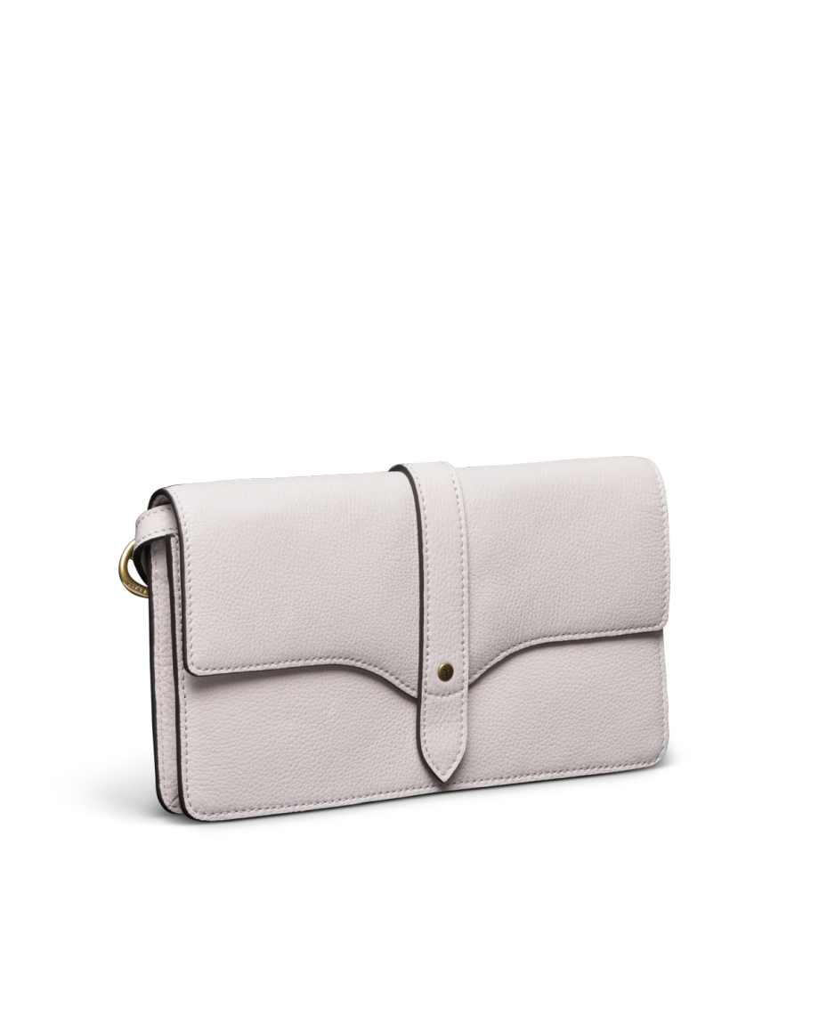 Quarterfront view of Women's Sierra Convertible Crossbody - Antique White on plain background