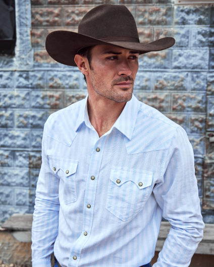 Man wearing cowboy hat and blue button up shirt