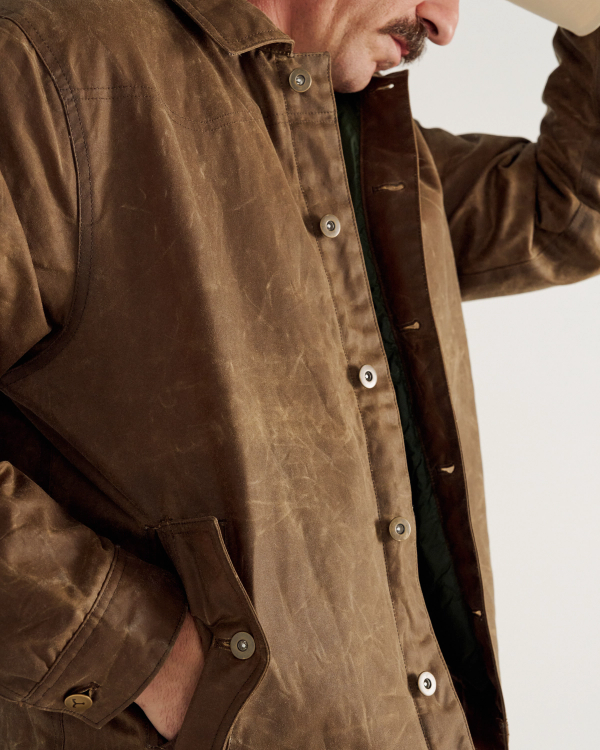 Close Up of Buckaroo Waxed Canvas Trucker Jacket - Tobacco on model