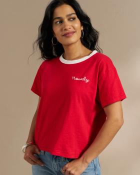 Woman wearing the Howdy Vintage Ringer Tee in Red in a studio