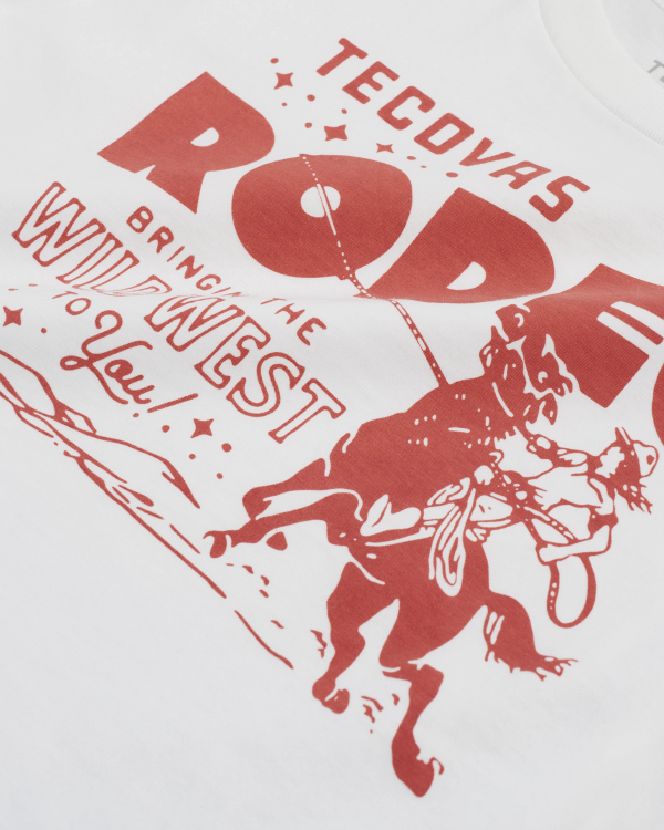 White T-shirt with red graphic of a cowboy on horseback and text that reads "Tecovas Rodeo, Bringing the Wild West to You!.