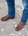 close up picture of Cole Pecan brown cowboy boots on a man's feet