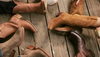 5 people wearing boots of various colors and leathers