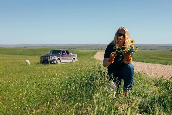 woman picking flowers