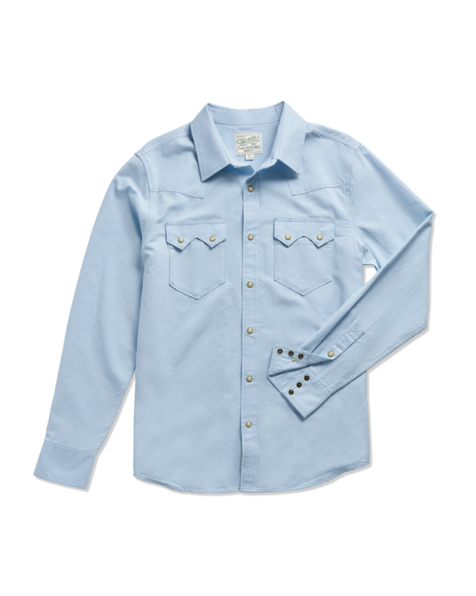 Light blue long-sleeve button-down shirt with two chest pockets, displayed against a plain background.