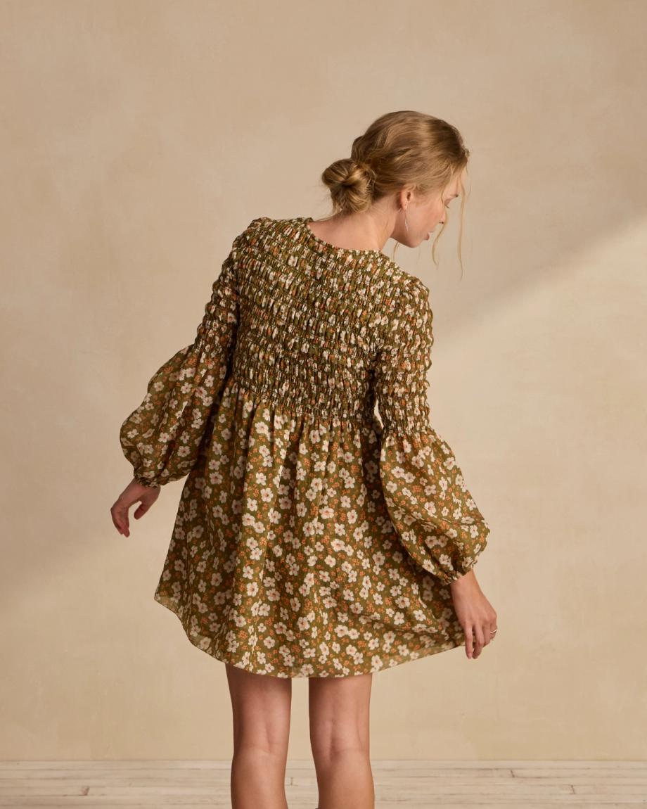 Back view of The Emma Dress by Kristopher Brock - Olive/Beige Floral Cotton Blend on plain background