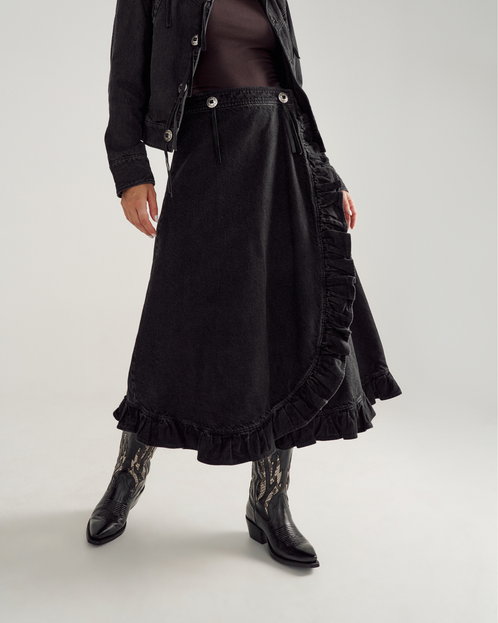 Front view of Women's Rodeo Maxi Denim Skirt - Black on model