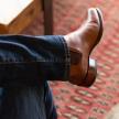 close up of Chance Chesnut Brown cowboy boots on a man's feet 
