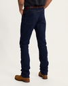 Back view of Men's Rugged Relaxed Jeans - Dark on plain background