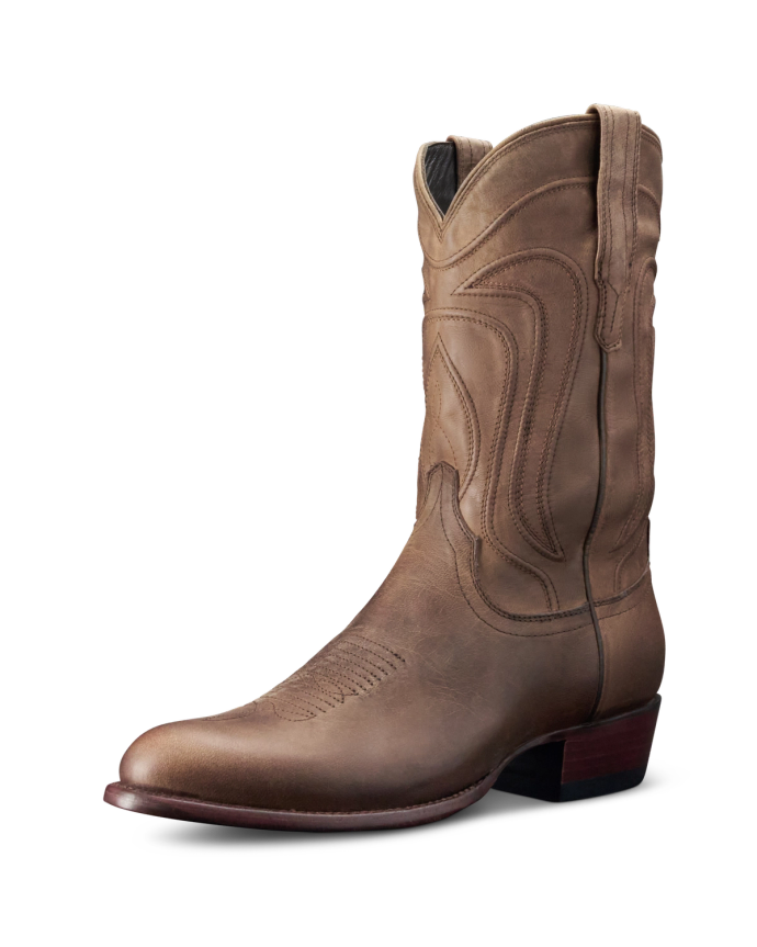 A single brown cowboy boot with decorative stitching, a pointed toe, and a low heel, displayed against a black background.