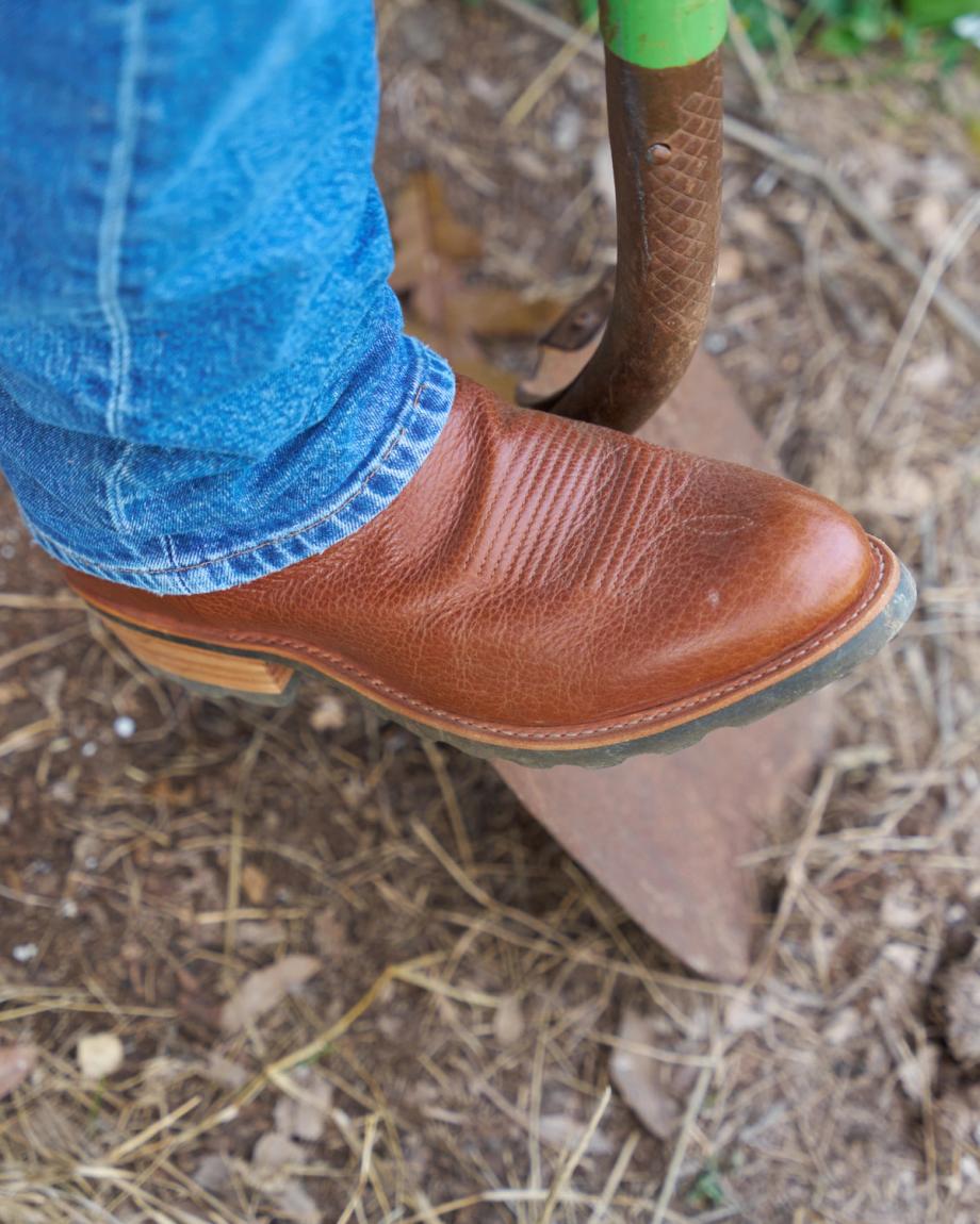 closeup image of sedona bandera at the ranch standing on a shovel
