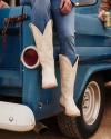 Image of woman wearing the Annie Bone sitting on a vintage truck