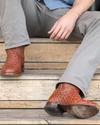 close up picture of Duke Pecan brown cowboy boots on a man's feet