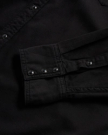 Closeup detail view of Men's Denim Long Sleeve Pearl Snap - Black