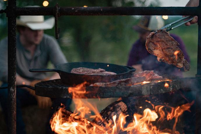 meat cooking over a fire