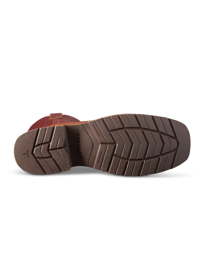 Sole of a brown shoe with a zigzag tread pattern, viewed from the bottom, showing the brand "Ted B's" imprinted on it.